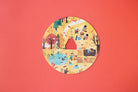 Circular paper cutout with illustrations of children playing on a red background