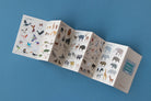 Foldout card with illustrations of animals on a blue background