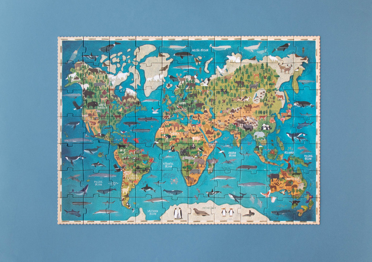 World map puzzle on a blue background