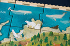 Jigsaw puzzle pieces depicting animals in a natural setting