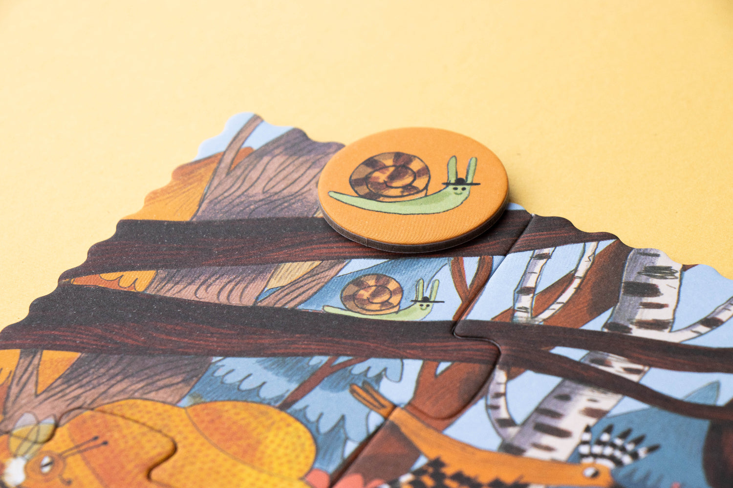 Children's puzzle with animal illustrations on a yellow background