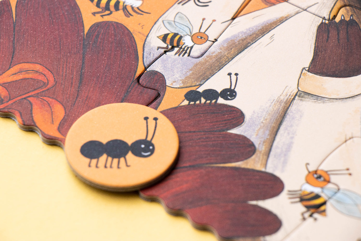Wooden puzzle piece with an ant design on a colorful background