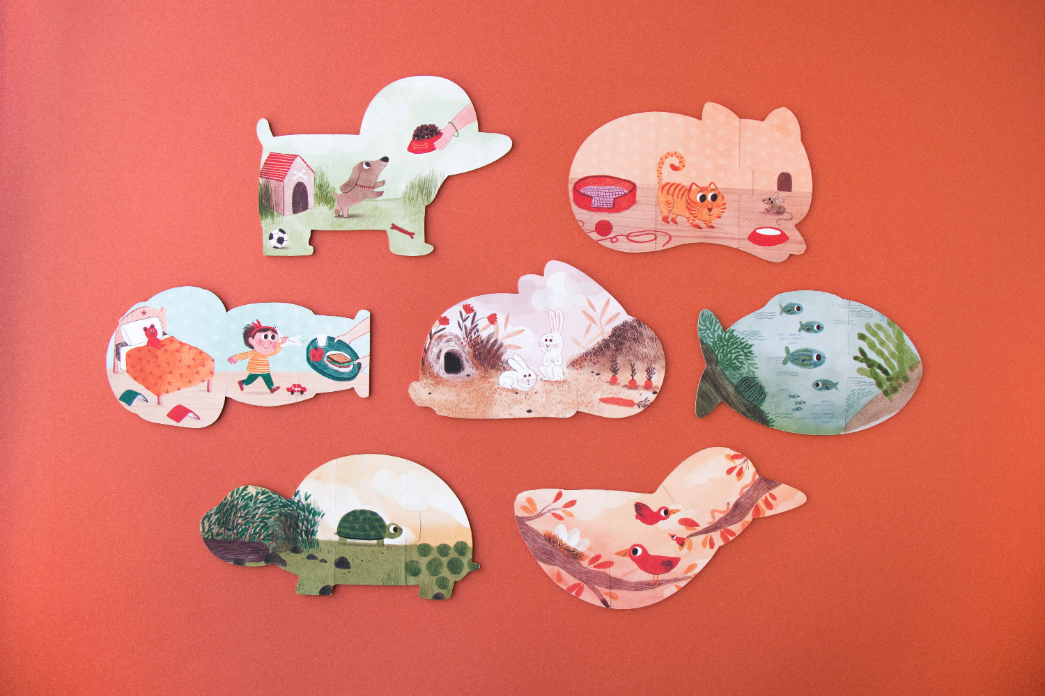 Set of animal-shaped puzzles on a red background