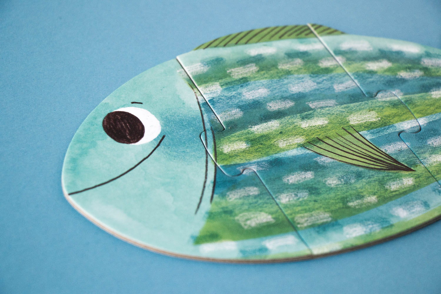 Fish-shaped puzzle on a blue background