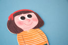 Colorful puzzle of a person with a red headband and orange striped shirt on a blue background