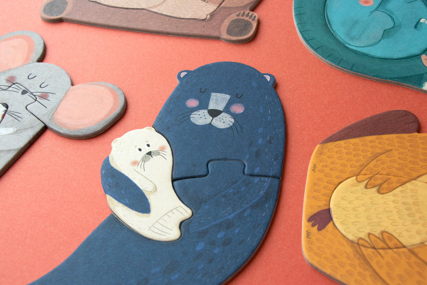Set of animal-shaped puzzles on a red surface