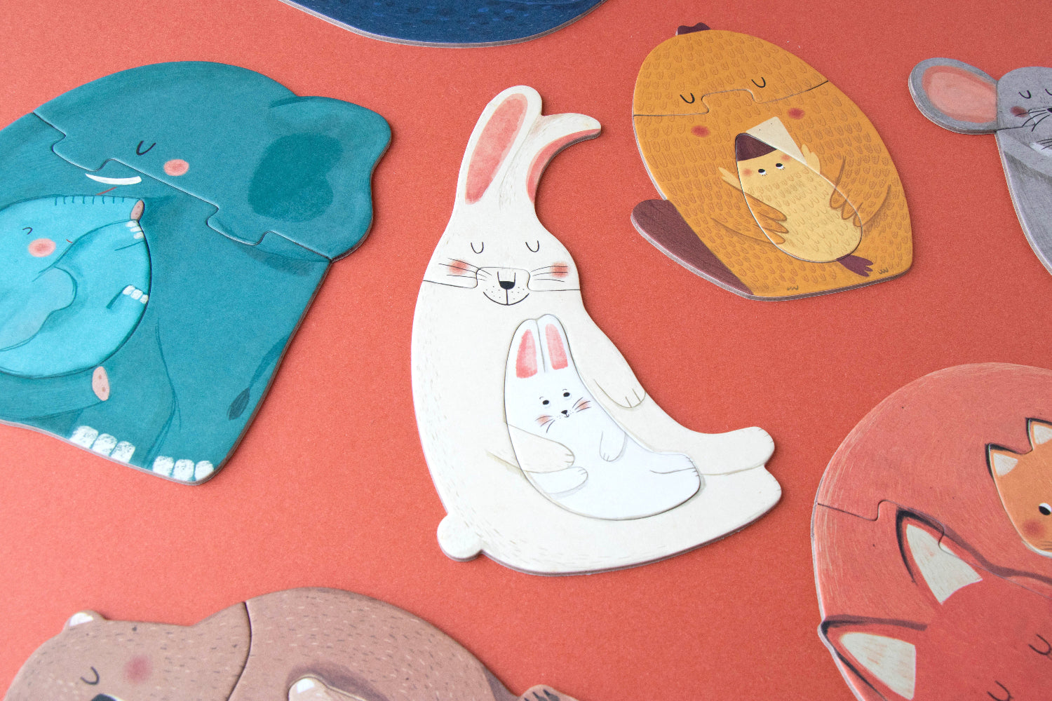 Cartoon animal puzzles on a red background
