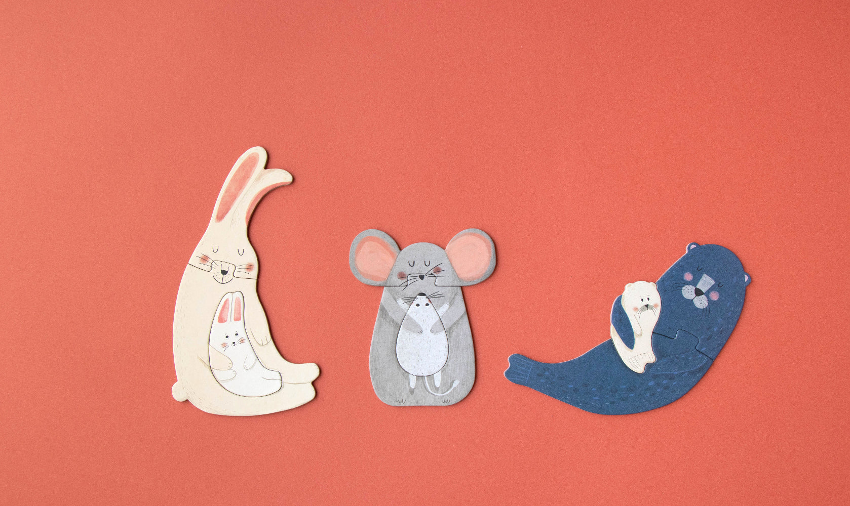 Three cartoon animal puzzles on a red background