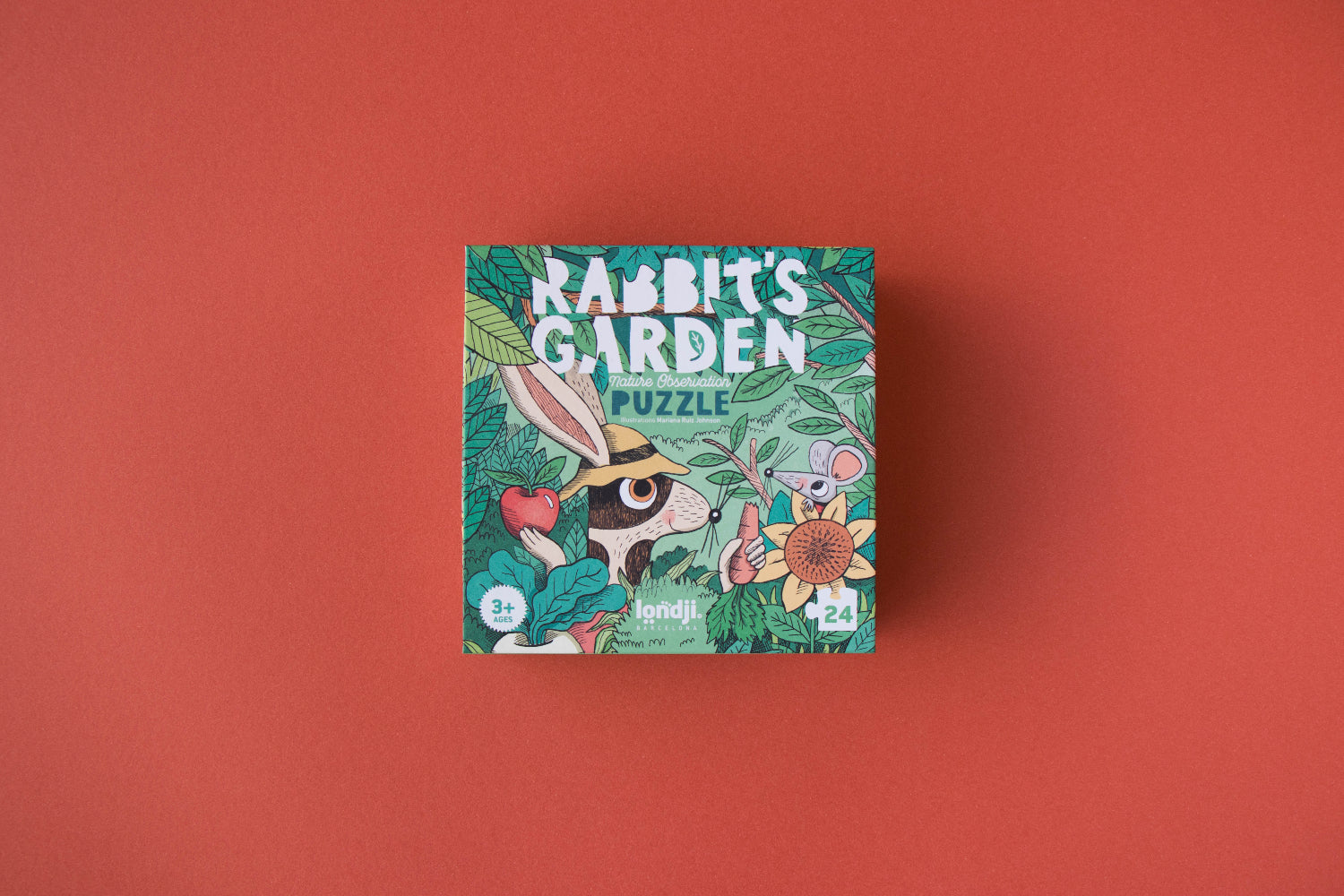 Box of 'Rabbit's Garden' puzzle on a red background