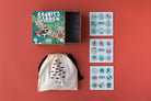 Educational children's products including a puzzle, drawstring bag, and sticker sheets on a red background