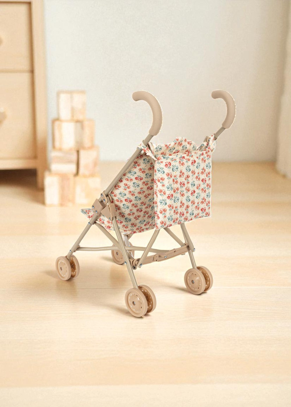 Full view of collapsible doll stroller in Lumina print with steel frame and wooden wheels