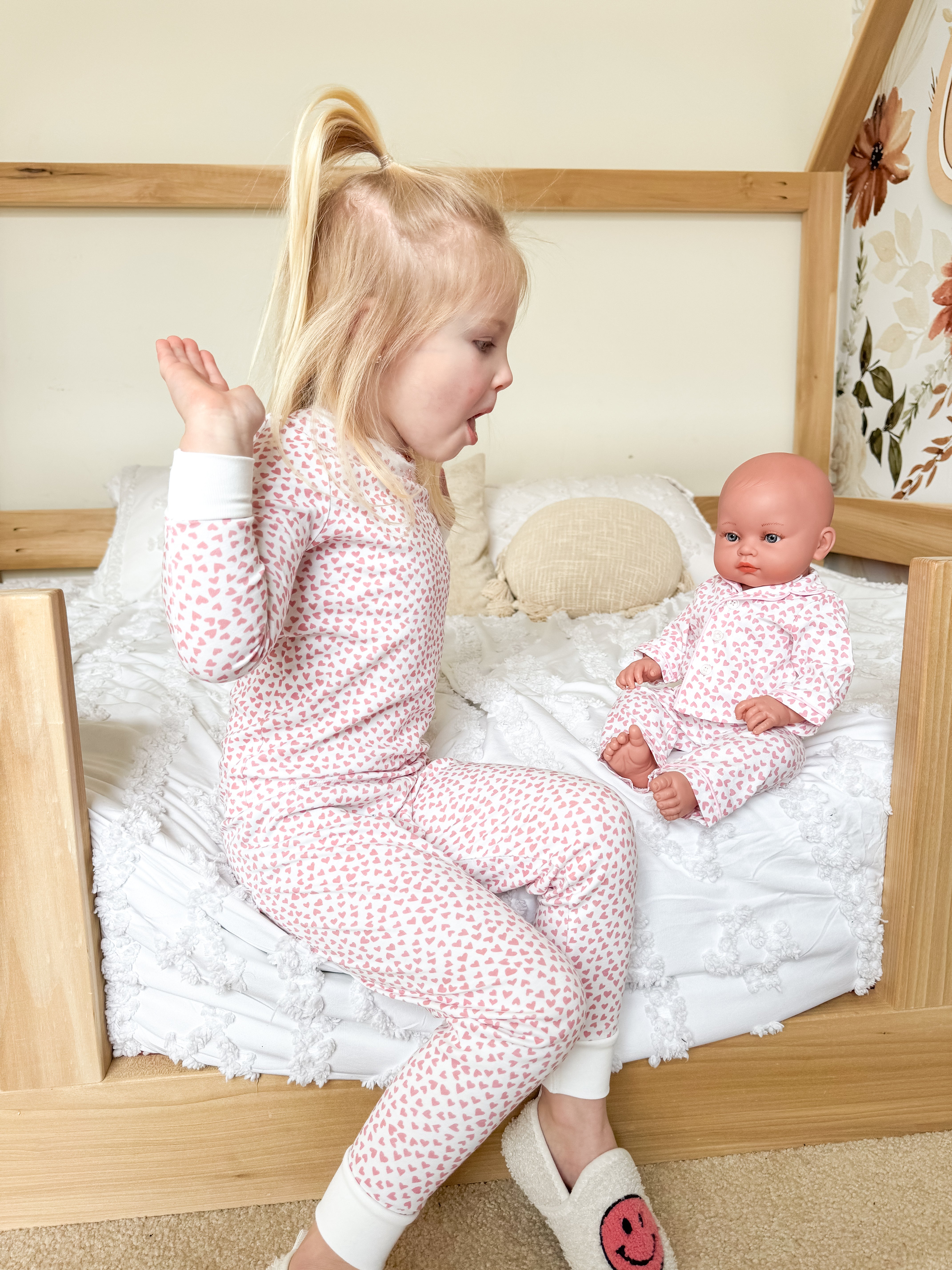 High five in matching pink pajamas