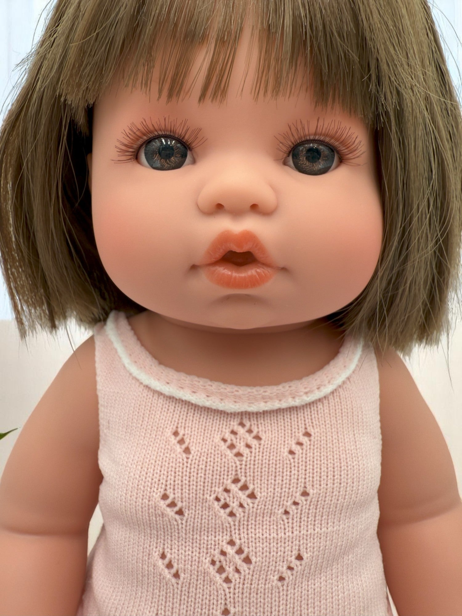 Milan baby doll for toddlers featuring realistic vinyl construction and moveable limbs for developmental play