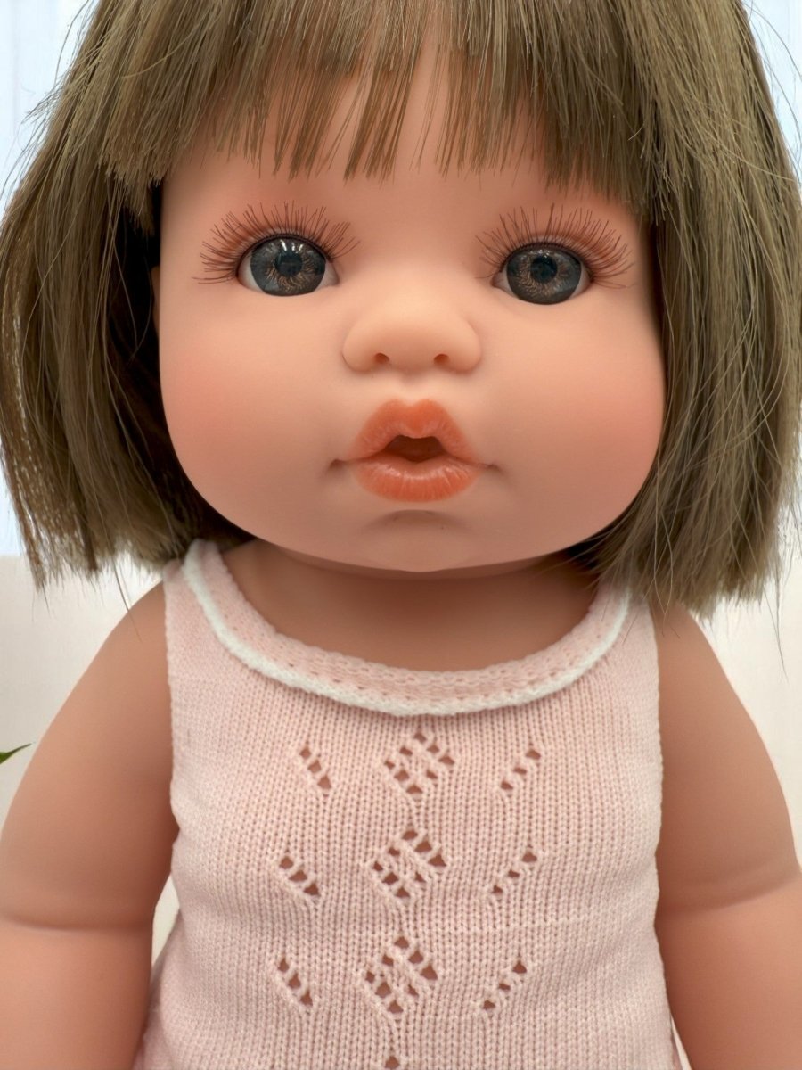 Milan baby doll for toddlers featuring realistic vinyl construction and moveable limbs for developmental play