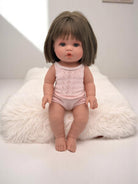 Lifelike baby doll Milan with brunette bob haircut perfect for children's playroom nurturing activities