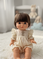 Spanish-made 13-inch Cherry doll showing realistic facial features and vanilla-scented vinyl body