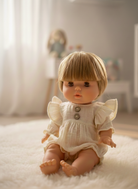 Spanish-made 13-inch Nina doll showing realistic features and vanilla-scented vinyl body