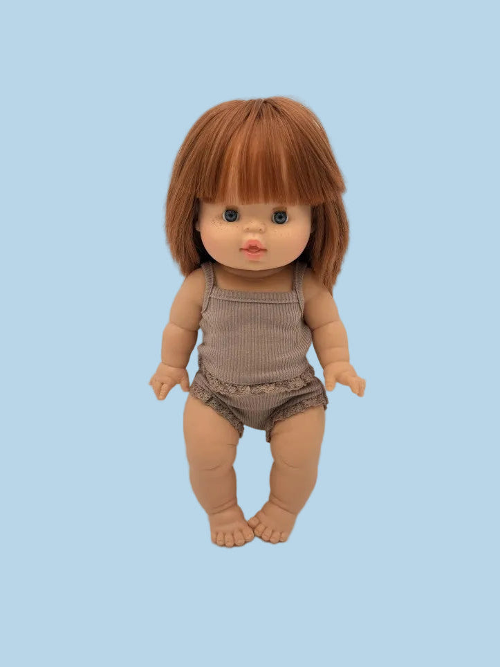 Doll with brown hair and outfit