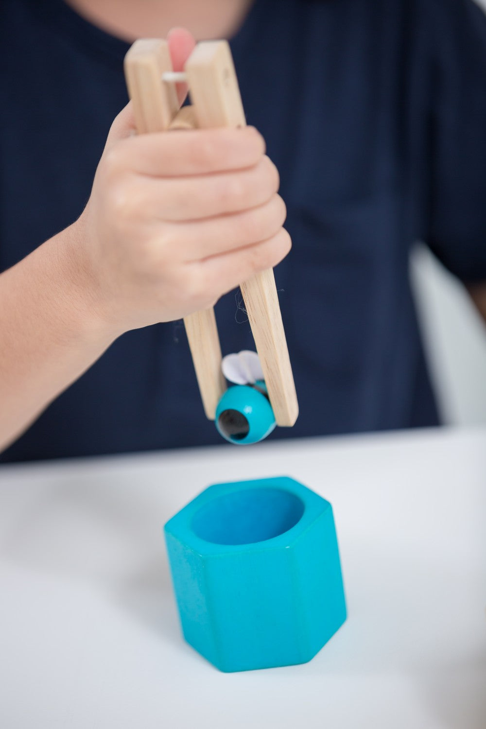 Close-up of PlanToys Beehives sustainable wood construction and vibrant colors