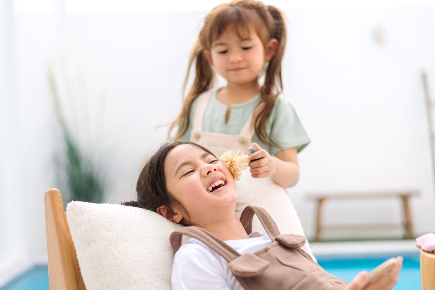 Child playing with PlanToys My Spa Time wooden pretend play spa accessories