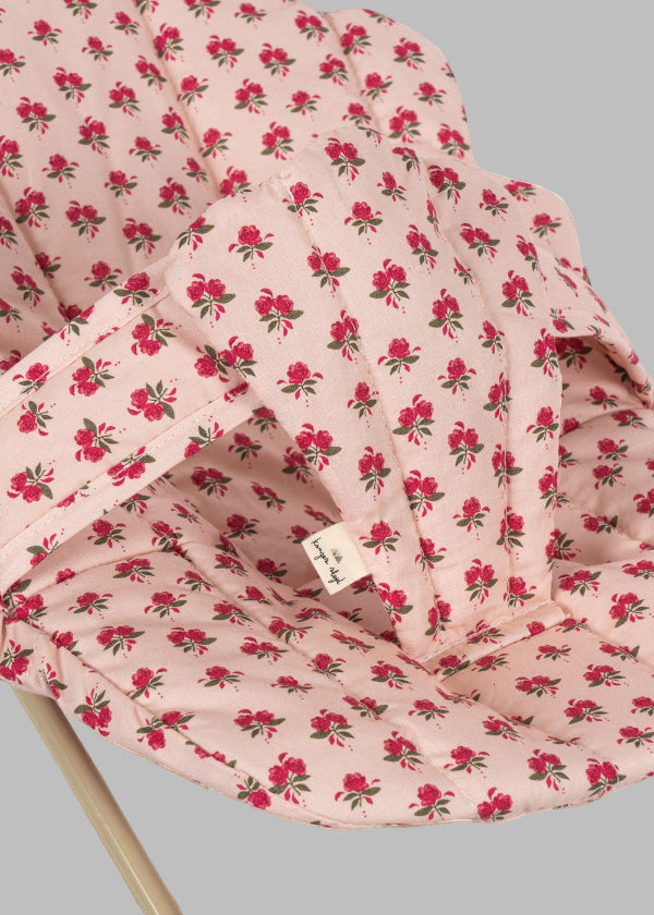 Close-up of Rosie Rose print fabric showing delicate pink roses with green leaves pattern and premium cotton texture