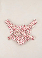 Back view of rose print doll carrier showing comfortable strap system and vintage floral pattern coverage