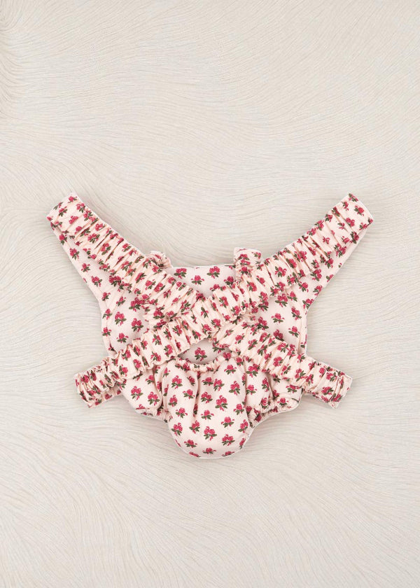 Back view of rose print doll carrier showing comfortable strap system and vintage floral pattern coverage