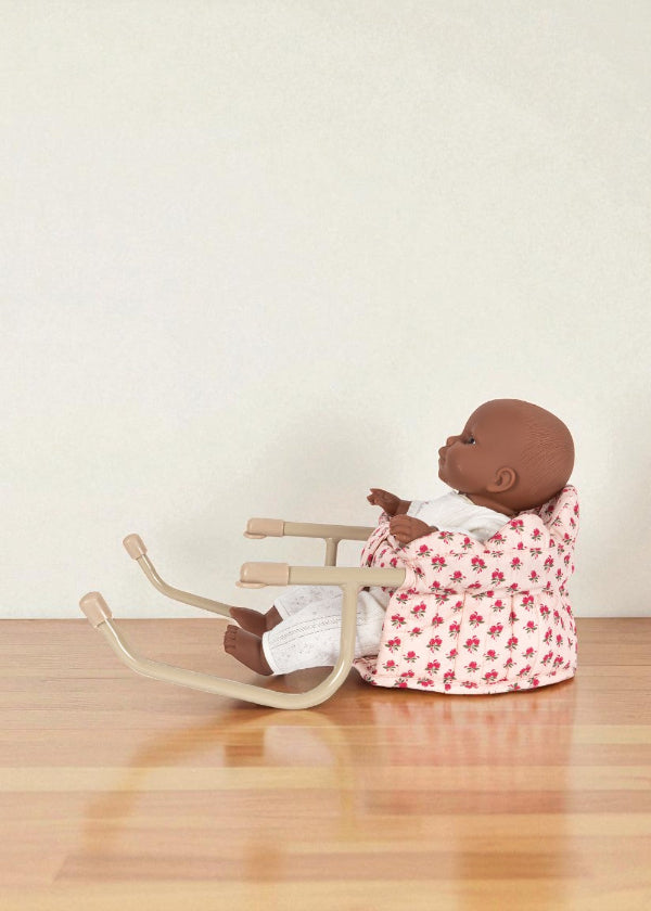 Side view of rose print table chair showing comfortable padded backrest and proper seating angle for realistic doll dining