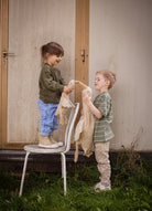 Small cream goose with grape seed warming pillow perfect for baby sleep comfort