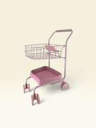 A pink metal shopping cart with a wire basket on top and a cushioned seat, shown on a plain cream background.