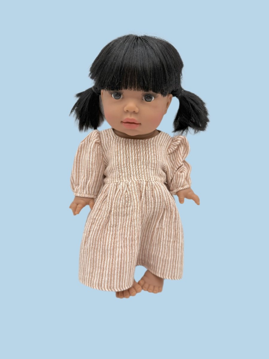 Miniature baby doll clothes with detailed stitching