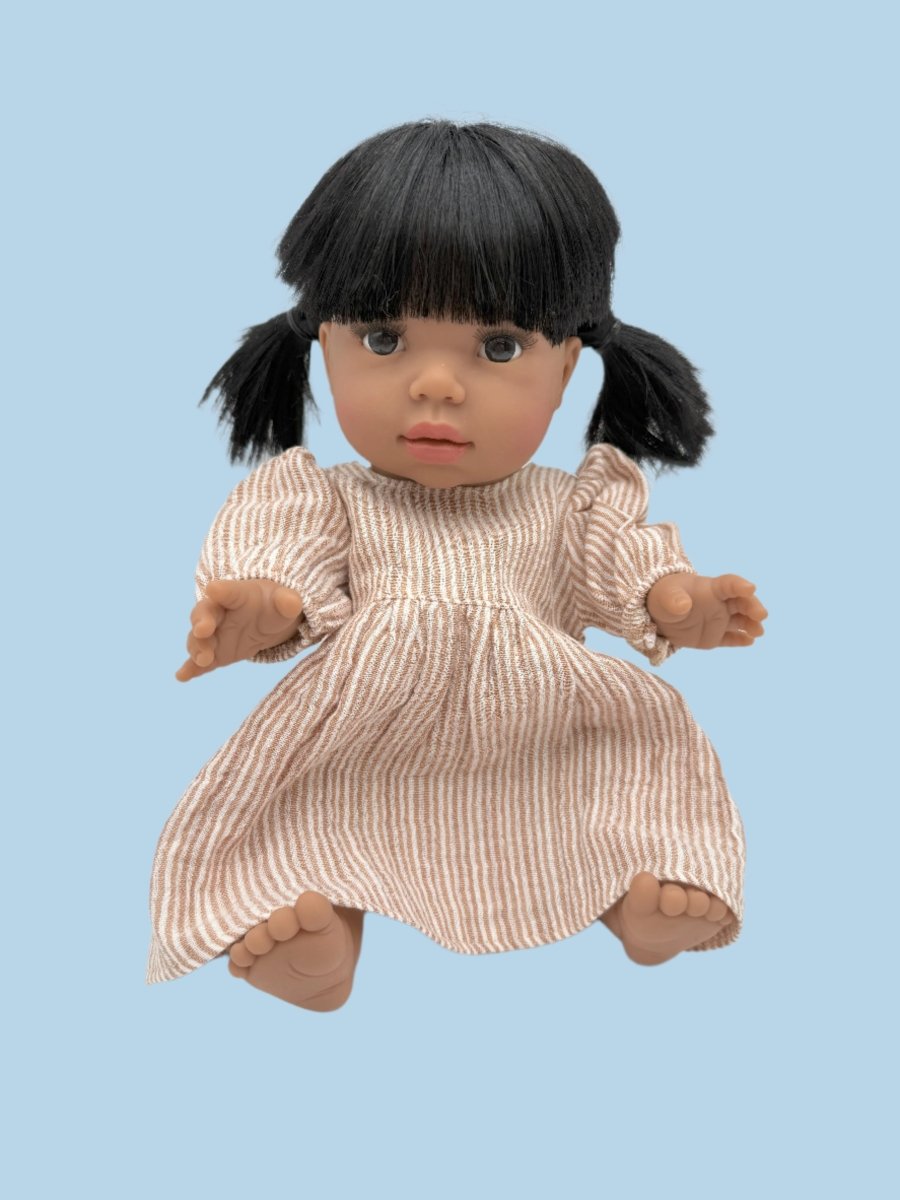 Handcrafted doll clothes in neutral linen fabric