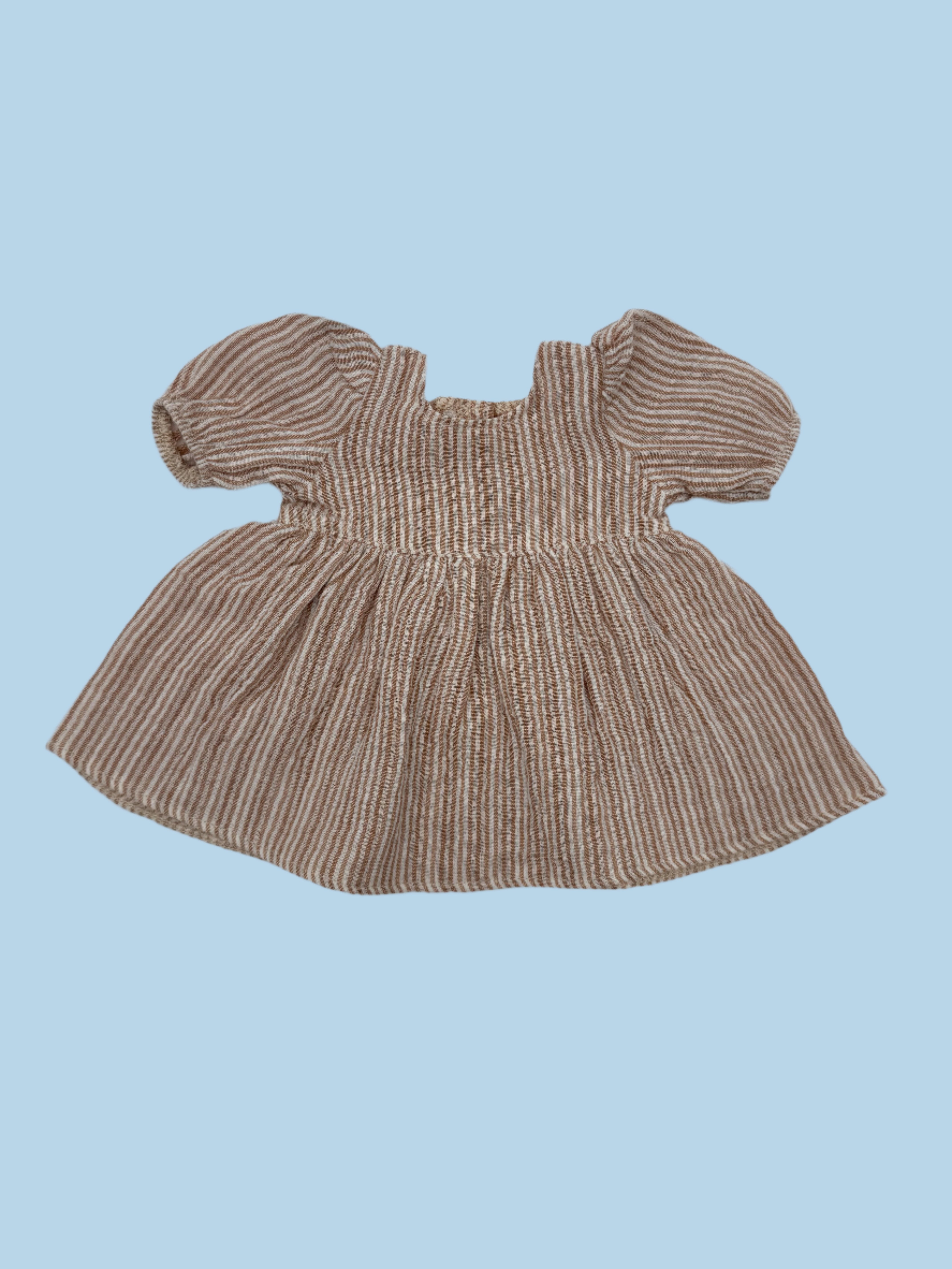 Artisanal dolls clothes in seasonal colors