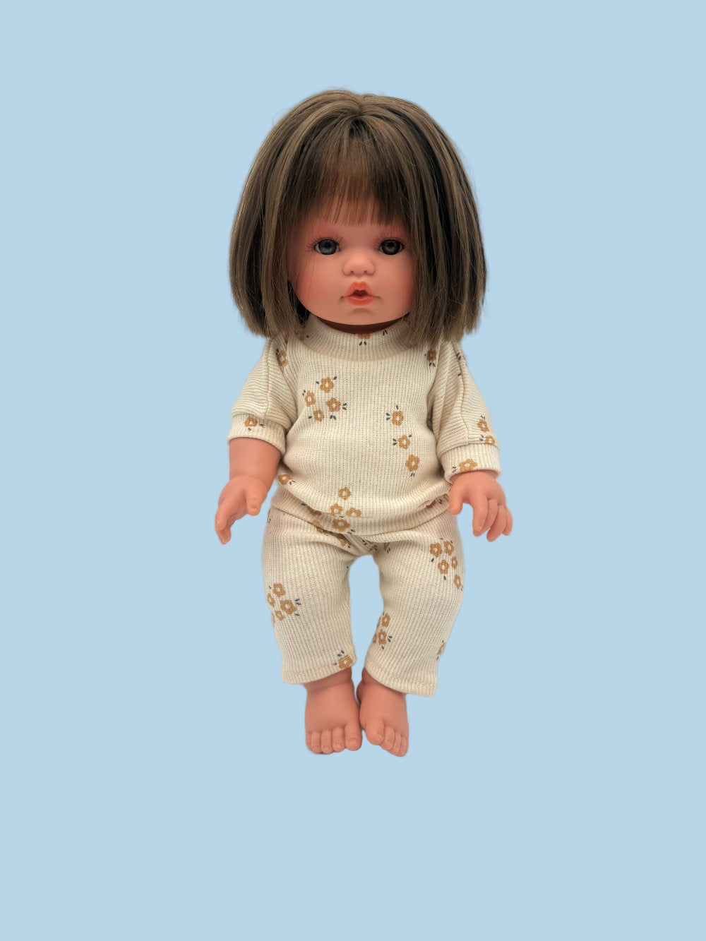 Cozy doll outfit featuring oat beige ribbed sweatshirt and pants with caramel flower pattern