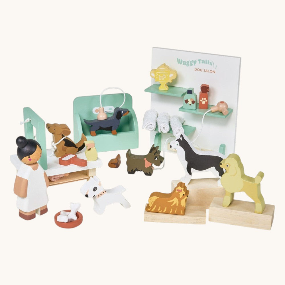 Wooden toy set with dogs and a vet, including a display stand with 'Waggy Tales' branding.