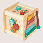 Colorful wooden toy with various interactive elements on a light gray background