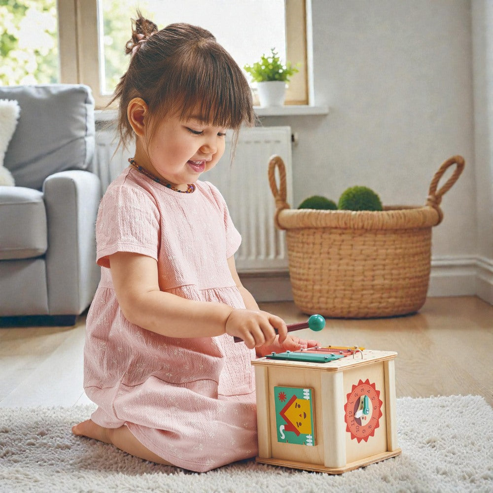 Close-up of Mentari activity cube showing colorful gears and interactive features