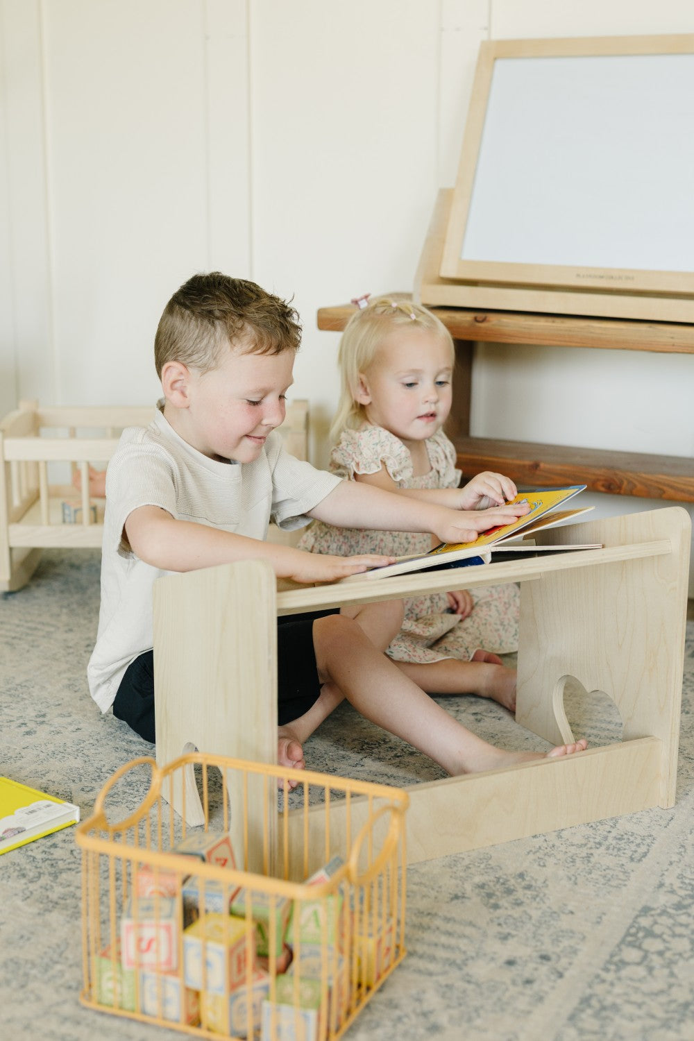 Two Children Reading on Lap Desk