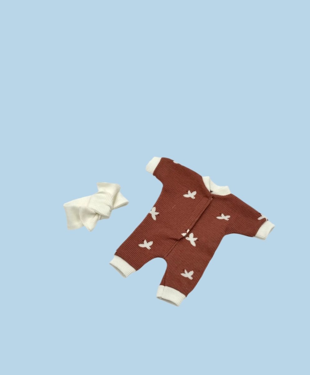 Baby doll outfit with custom embroidered motifs