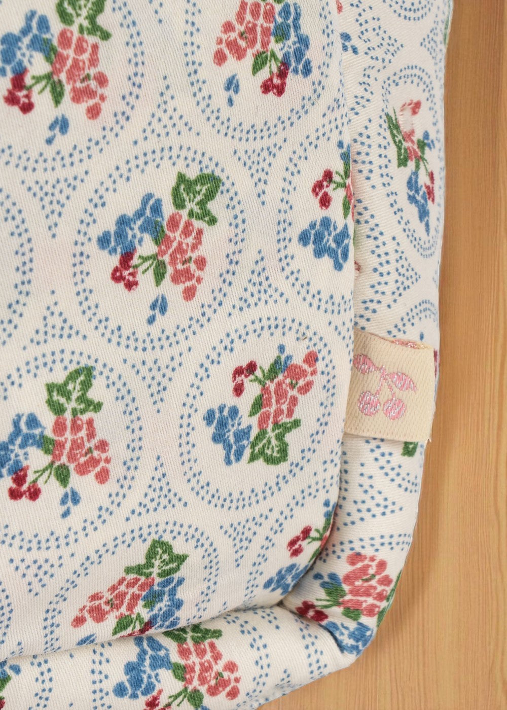 European-inspired children's doll care bag with cottage-core botanical pattern