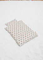 Verona Blues bedding set with Italian-inspired floral print blanket and pillow arranged together showing coordinated Mediterranean design