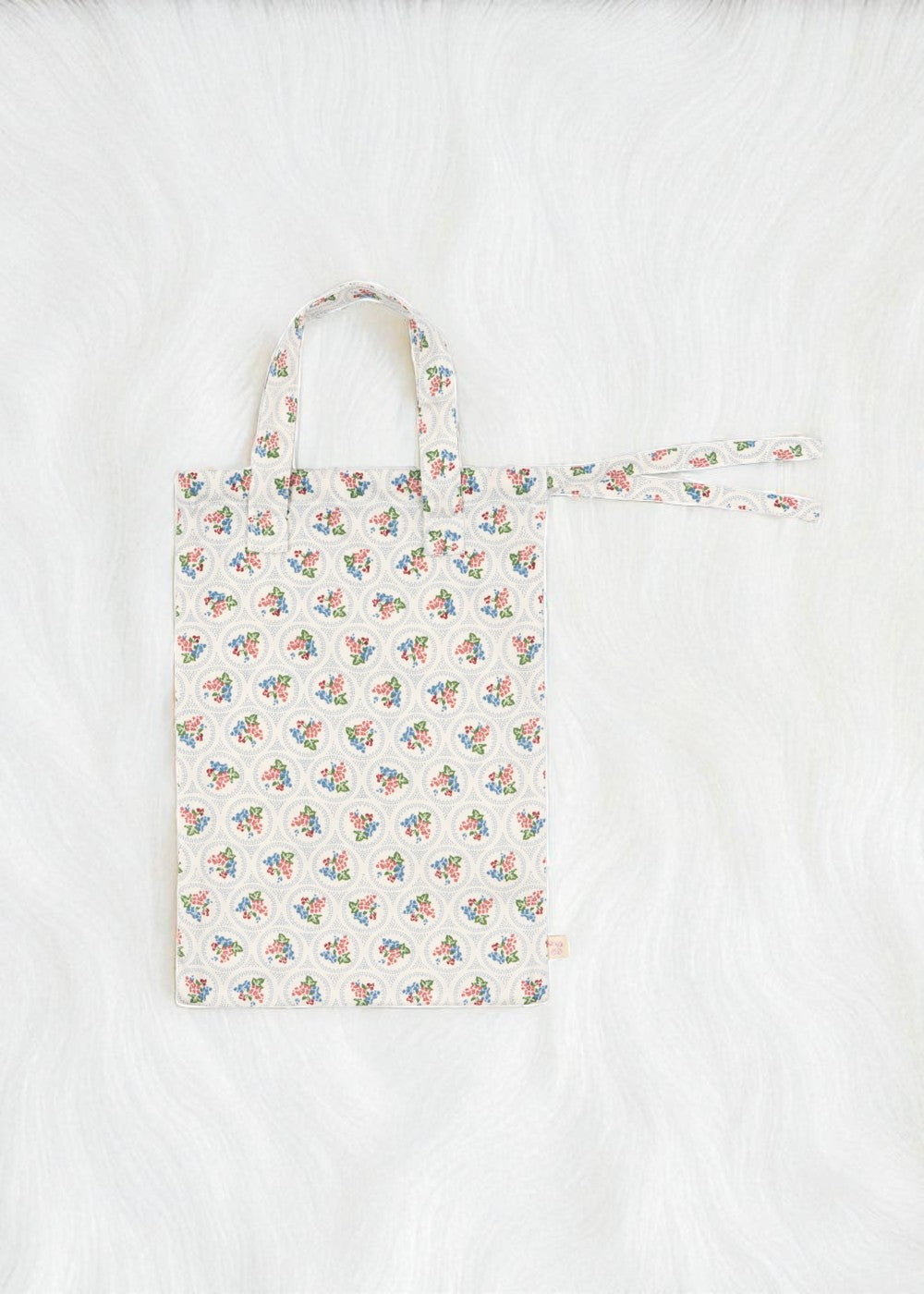 Premium construction detail showing button-tufted craftsmanship of Verona Blues doll bedding set