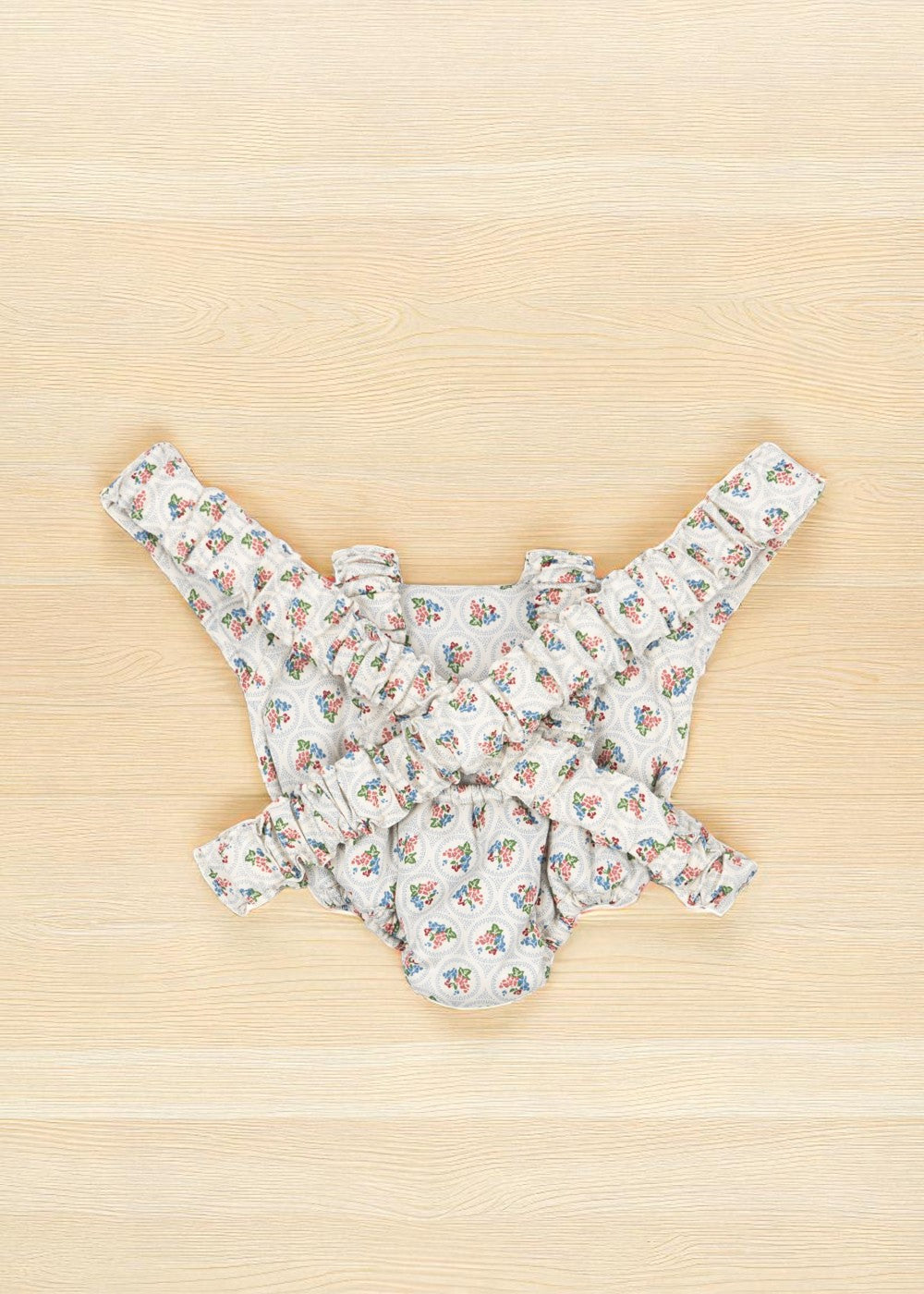 Back view of Verona Blues carrier showing blue floral bouquets with cherry accents and complete Mediterranean pattern