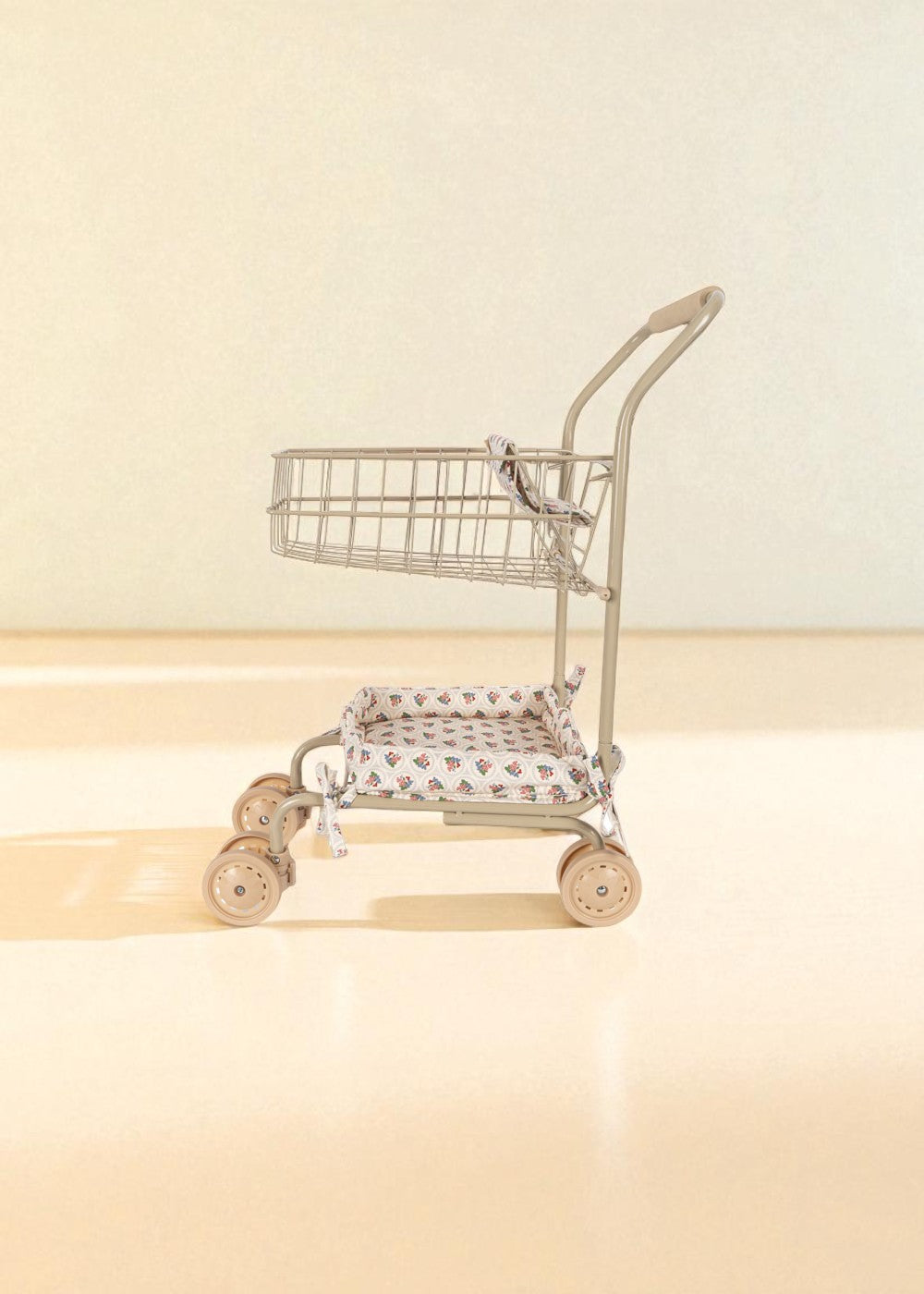 Full view of steel frame doll shopping cart in Verona Blues print with swivel wheels and basket