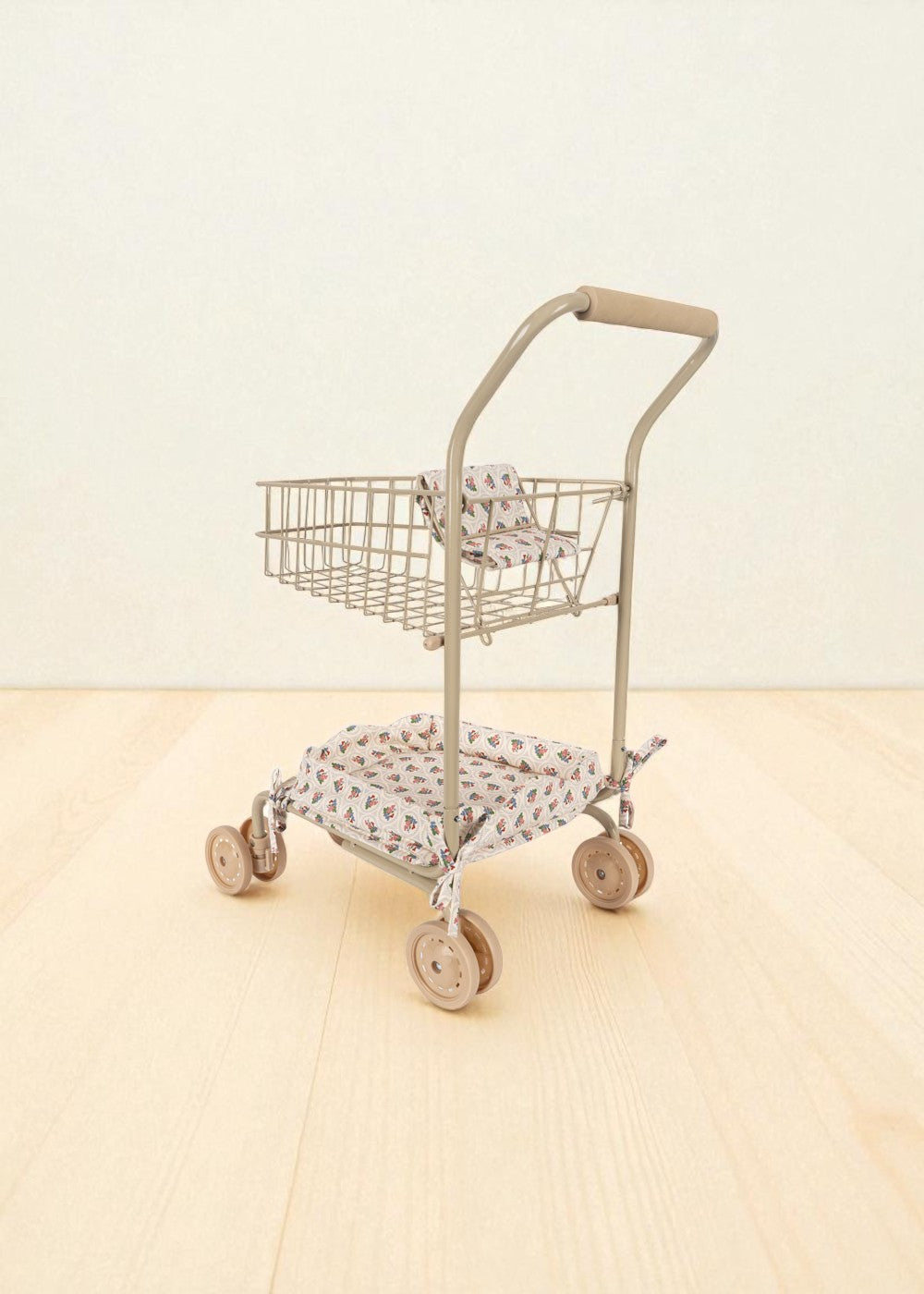 Doll shopping cart showing wire storage basket and floral seat in coral and teal