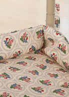 Close-up of Verona Blues floral cotton fabric with botanical print on doll shopping cart