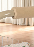 Doll shopping cart showing wire storage basket and floral seat in coral and teal