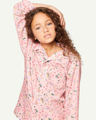 Full pajama set in soft pink with multicolor candy print and pearl button closure