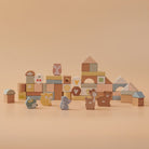 Wooden blocks with animal designs on a beige background