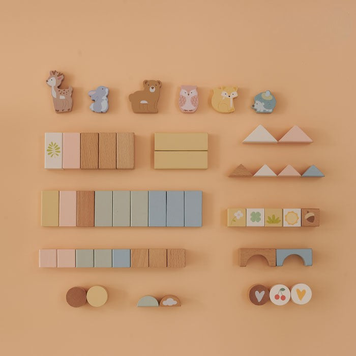 Flat lay of all 50 pieces organized by type showing 6 animal blocks and 44 shape blocks in assorted colors and shapes
